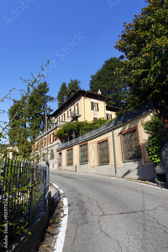 Fototapeta Naklejka Na Ścianę i Meble -  The very narrow winding road from Como city to  Brunate town, Italy, sept. 2015