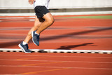 Man Running on track at Sport Stadium