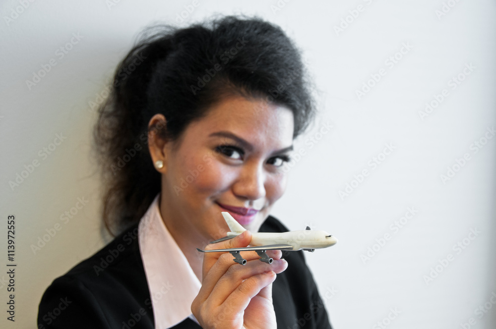 Business woman hold plane model toy on hand Business woman hold plane model toy on hand