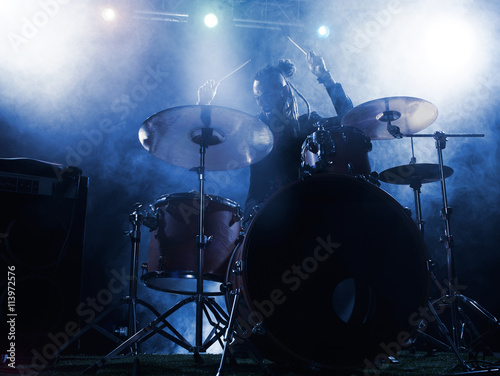Silhouette drummer on stage.