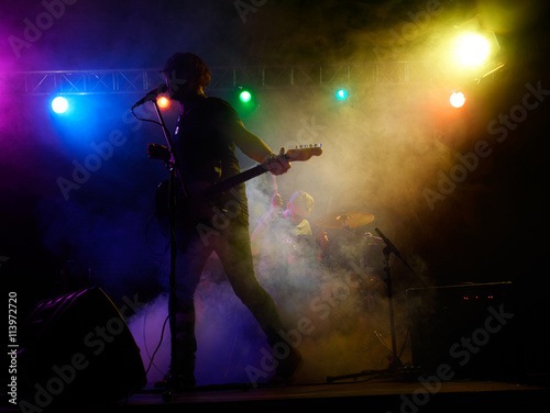 Fototapeta Naklejka Na Ścianę i Meble -  Silhouette of guitar player on stage.