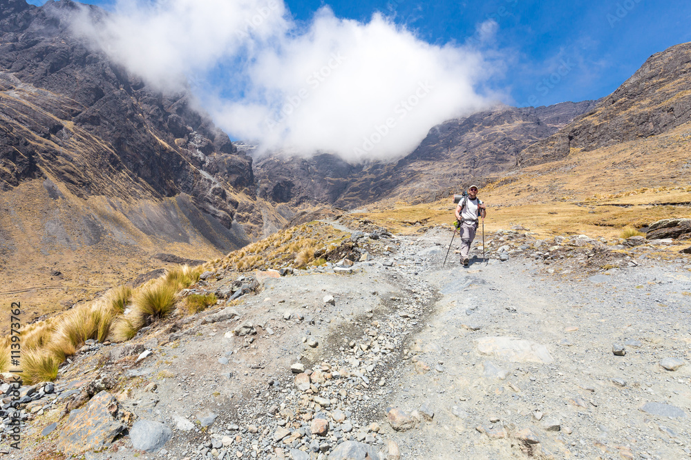 Backpacker mountaineer walking posing mountain trail, El Choro t