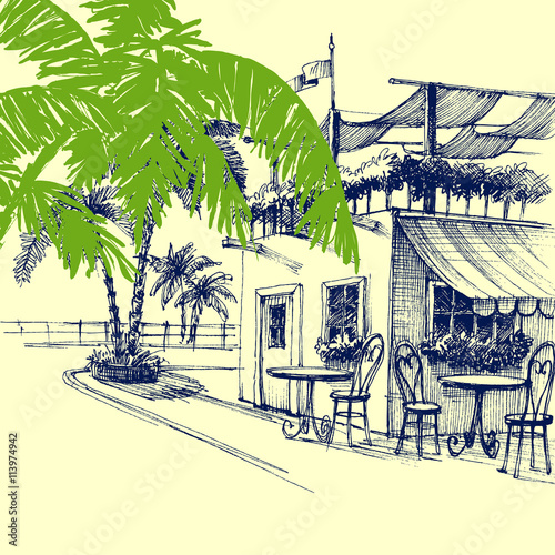 Restaurant on the beach. Terrace and palm trees