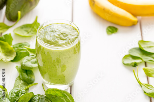 Absolutely Amazing Tasty Green Avocado Shake, Made with Fresh Avocados, Banana, Lemon Juice and Non Dairy Milk (Almond, Coconut) on Light White Wooden Background, Raw, Vegan Drink Conception, Close-up