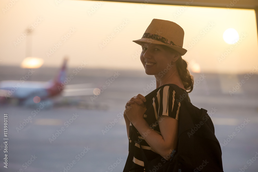 Woman in front of takeoff ground Woman in front of takeoff ground
