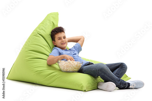 Kid sitting on a comfortable beanbag
