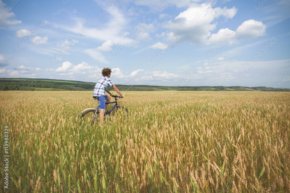 Portrait of a boy with a bicycle