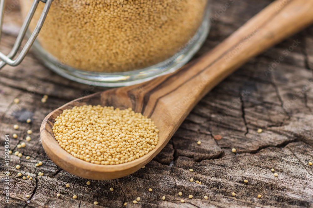 Raw Organic Amaranth Grain on wooden background Raw Organic Amaranth Grain on wooden background