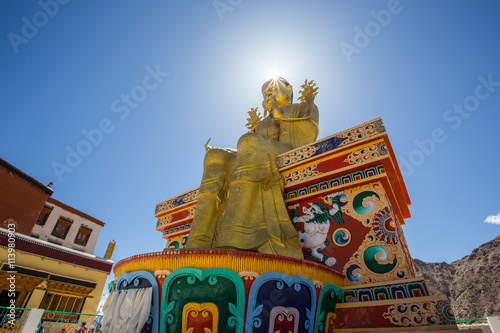 Giant golden sculpture of the Mitreya Buddha in the monastery of photo