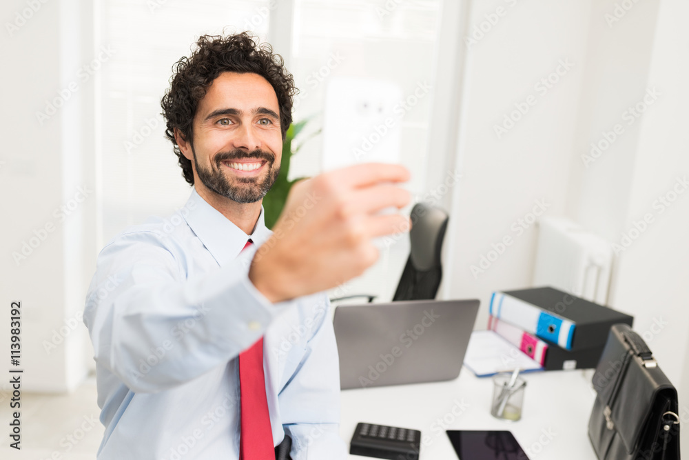 Businessman taking a selfie portrait