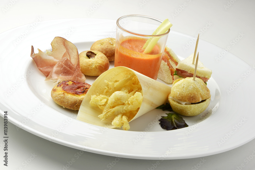 Plate of mixture of finger food for aperitif Plate of mixture of finger food for aperitif