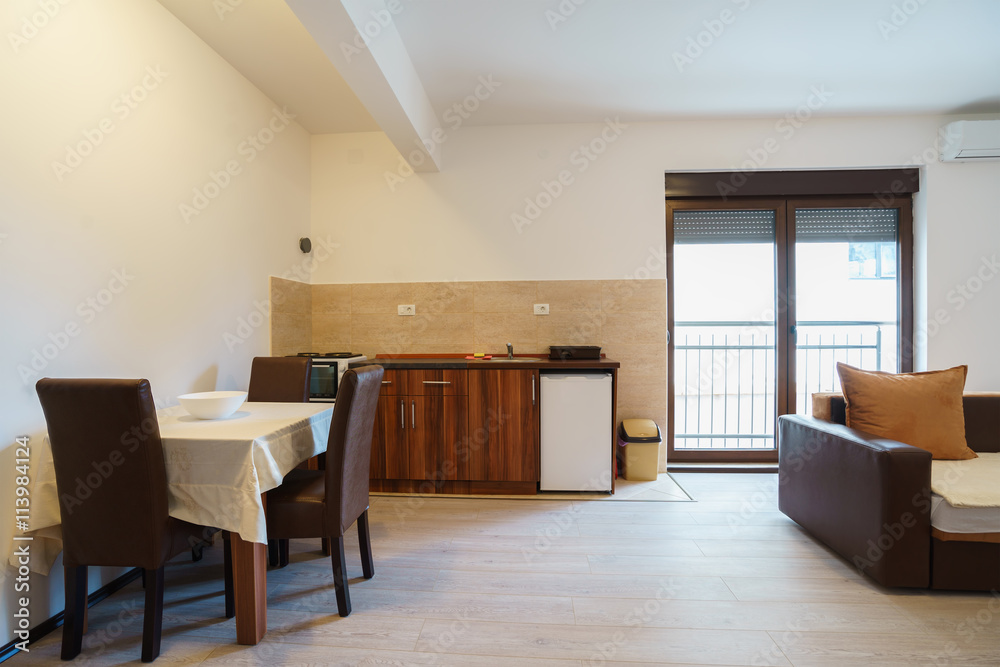 Fototapeta premium Interior of a guest house room with kitchen