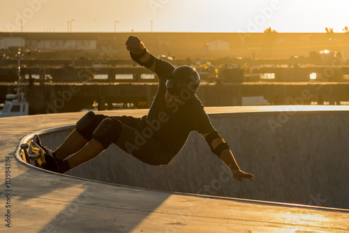 Skateboarder in a concrete pool