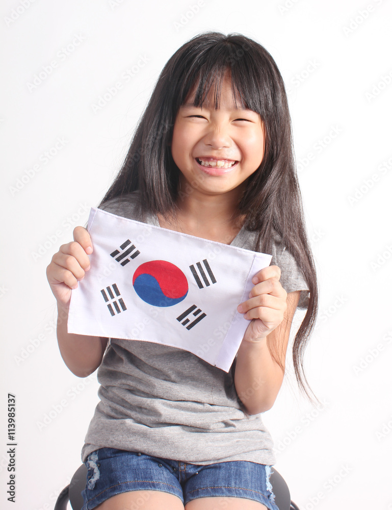 Cute girl holding Korea Flag on white background. Stock Photo Adobe Stock