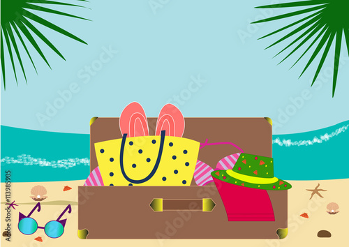 Coast and sea waves. Suitcase with summer things  lie on the beach. Collect the suitcase. 
