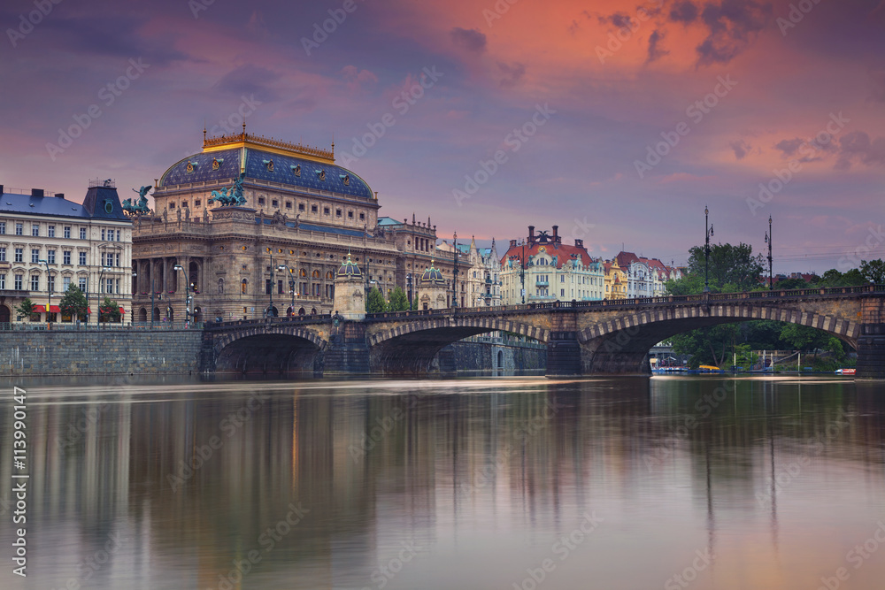 Prague. Image of Prague riverside with reflection of the city in Vltava River.