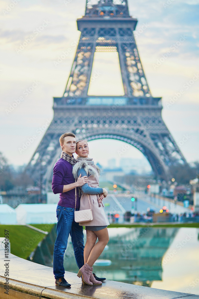 Romantic couple near the Eiffel tower in Paris, France