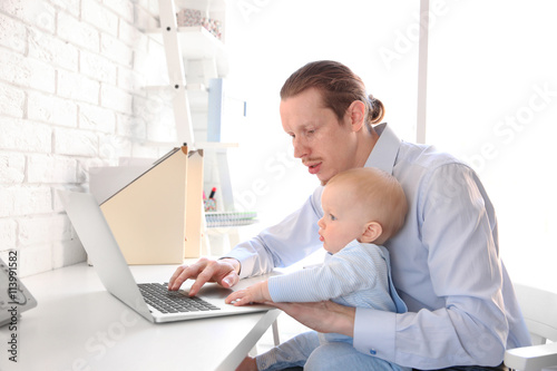 Young father with his littl...