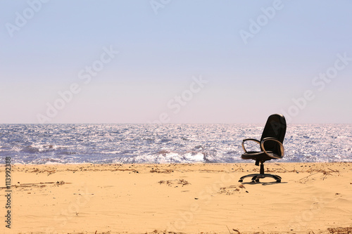 An office chair on the beach © Africa Studio