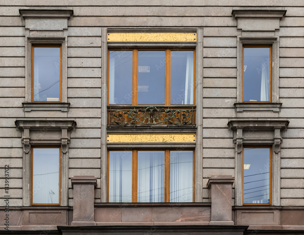 Several windows in a row on facade of Singer House front view, St. Petersburg, Russia