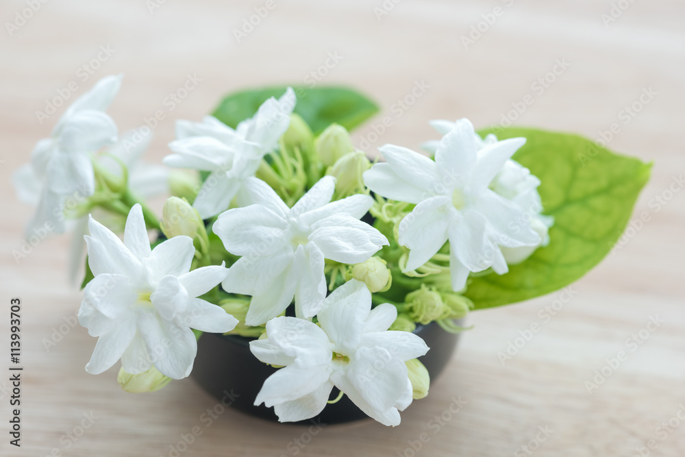 Fototapeta premium Close-up Jasmine flowers on a wood table