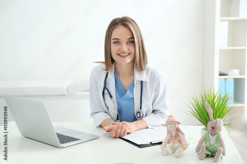 Young beautiful female doctor working at the office Young beautiful female doctor working at the office