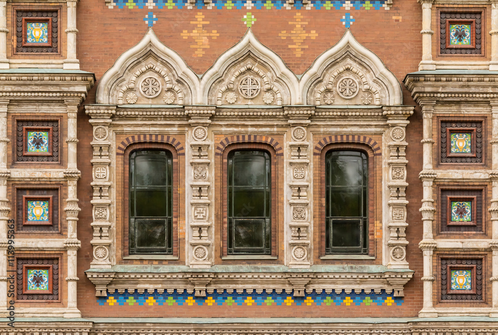 Several windows in a row on facade of the Church of the Savior on Spilled Blood front view, St. Petersburg, Russia. Several windows in a row on facade of the Church of the Savior on Spilled Blood front view, St. Petersburg, Russia.