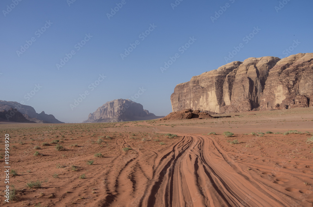 Obraz premium Road thru desert and rocks of Wadi Rum (Valley of the Moon), Jordan