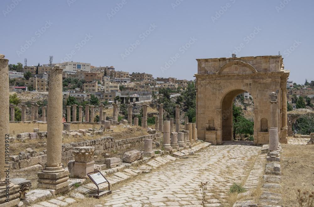Columns in Colonnaded Street and Northern Tetrapylon at background, Ancient Roman city of Gerasa of Antiquity , modern Jerash, Jordan