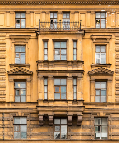 Several windows in a row and bay window on facade of the Saint-Petersburg University of Economics front view, St. Petersburg, Russia
