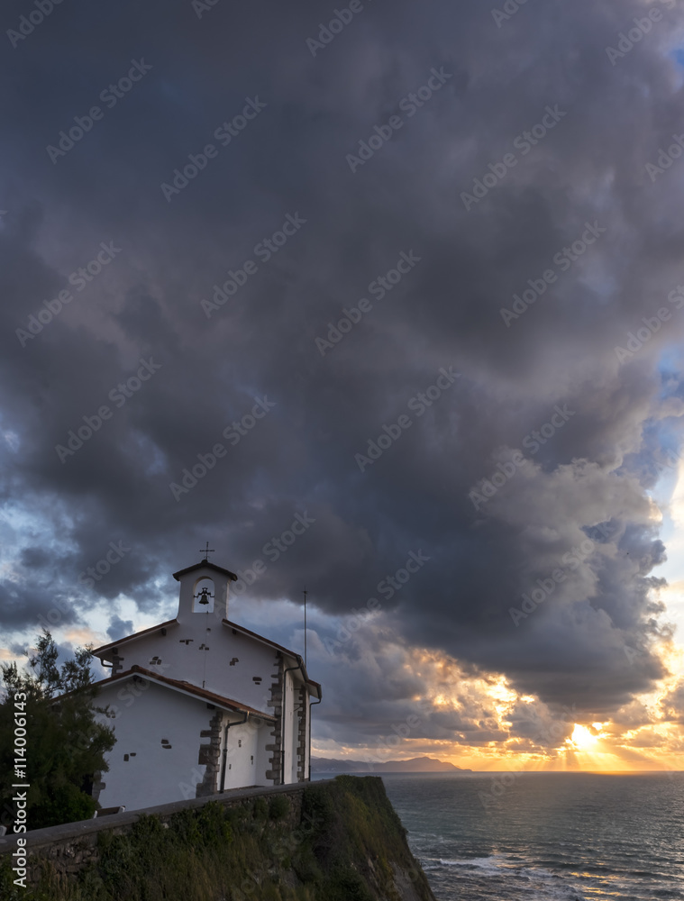 San Telmo chapel and beach of Itzurun in Zumaia at sunset. Basque Country San Telmo chapel and beach of Itzurun in Zumaia at sunset. Basque Country