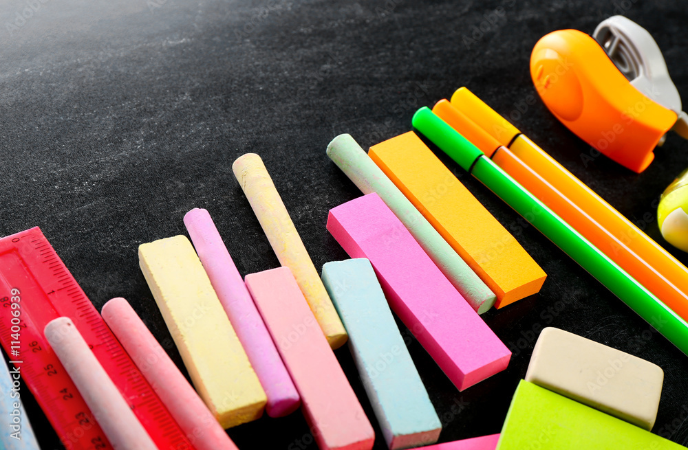 Colourful stationery on black background Colourful stationery on black background