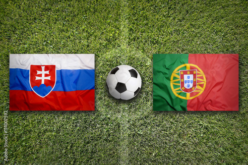 Slovakia vs. Portugal flags on soccer field