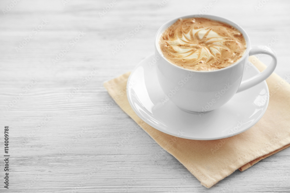 Fototapeta premium Cup of fresh coffee on napkin