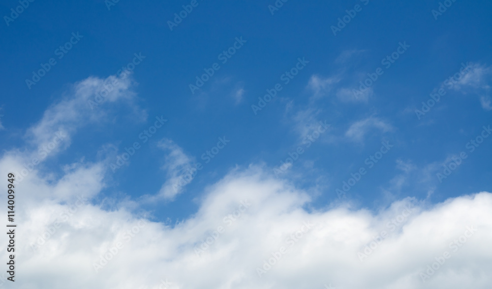 White clouds in the blue sky. Cloudscape over horizon. White clouds in the blue sky. Cloudscape over horizon.