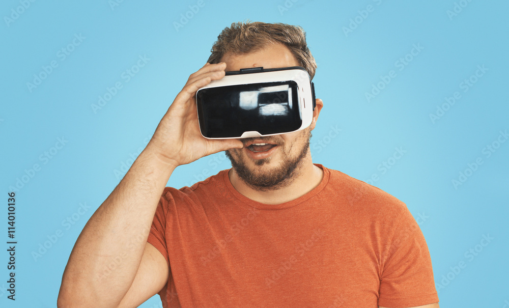 Young man wearing virtual reality goggles. Young man wearing virtual reality goggles.