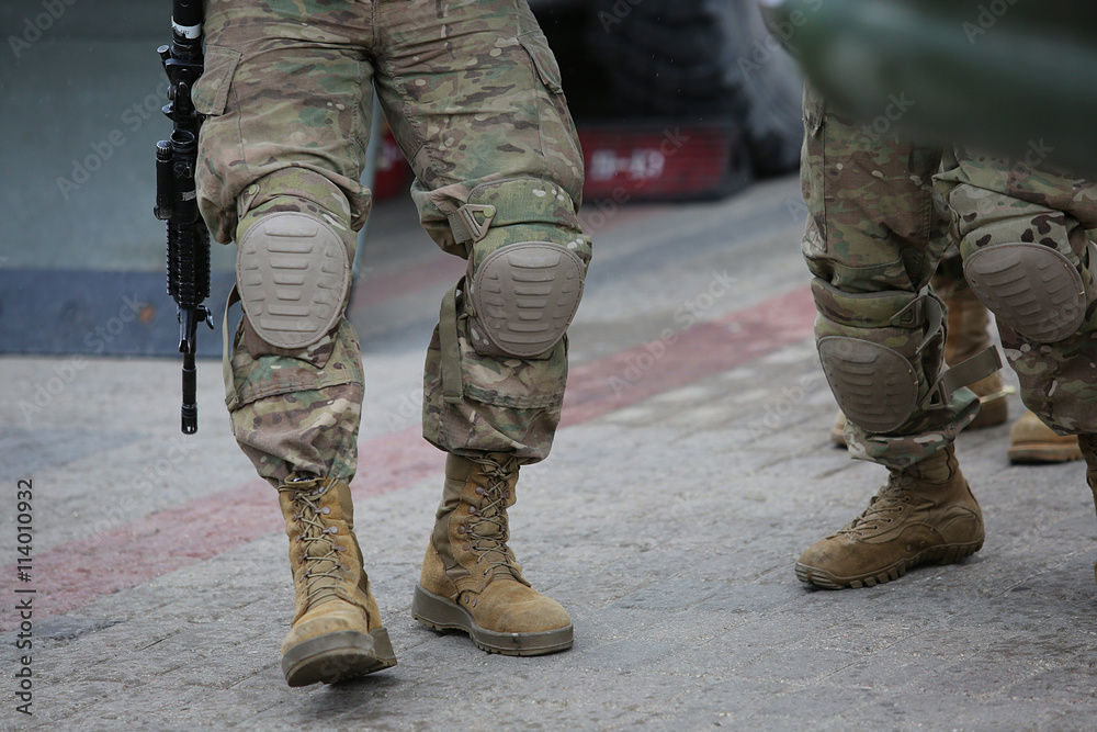 Legs of soldiers in camouflage Legs of soldiers in camouflage