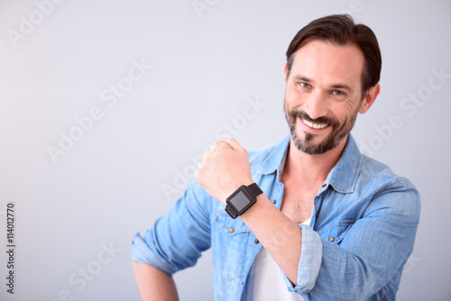 Man showing smart watch on his wrist