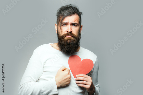 sad man with paper heart © Volodymyr