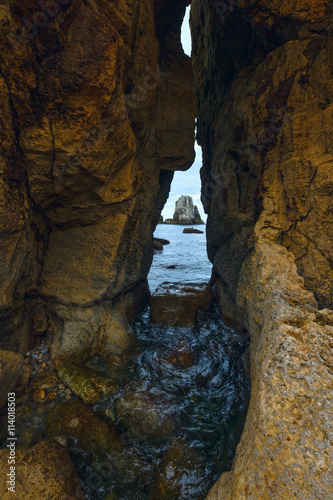 Seascape through slit in rock.