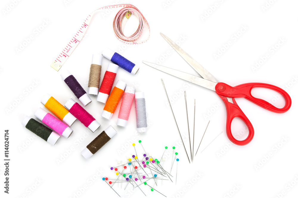 Set of needlework with scissors, needle, thread, measuring tape, pin isolated on white background Set of needlework with scissors, needle, thread, measuring tape, pin isolated on white background