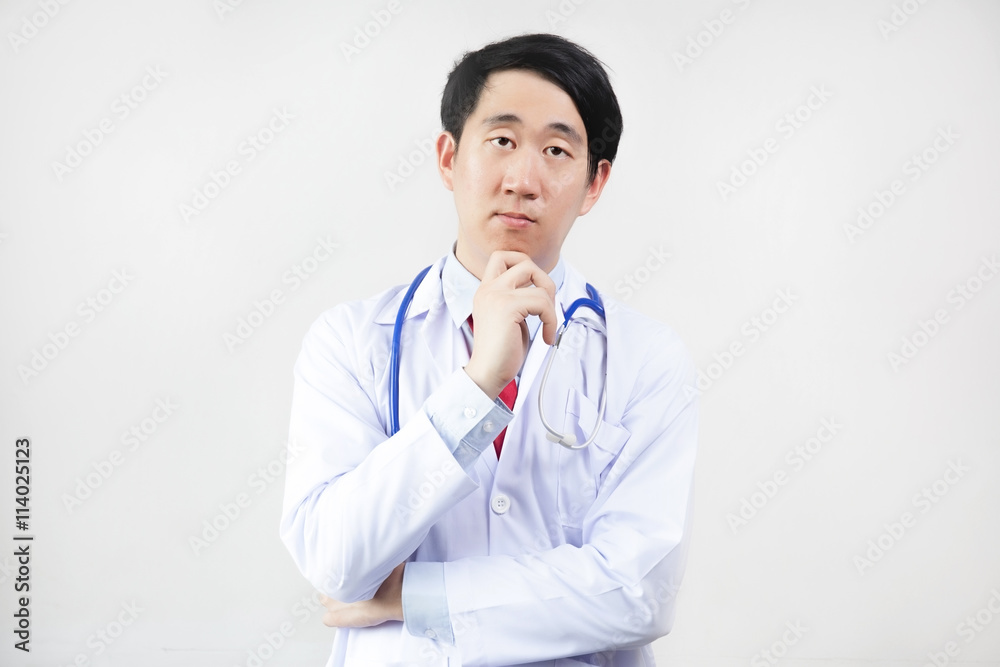 Asian doctor in lab coat think in white background Asian doctor in lab coat think in white background