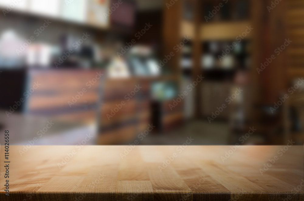 Selected focus empty brown wooden table and space of Coffee shop