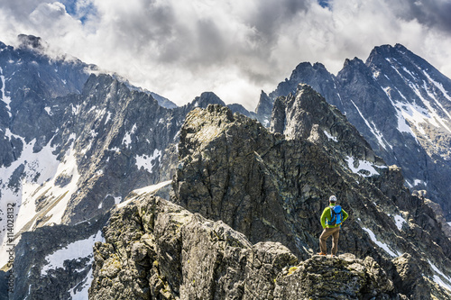 Photography Standing on an exposed ridge.