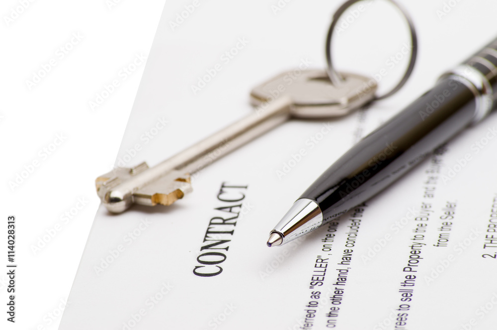 Keys of a new house and pen on contract. Keys of a new house and pen on contract.