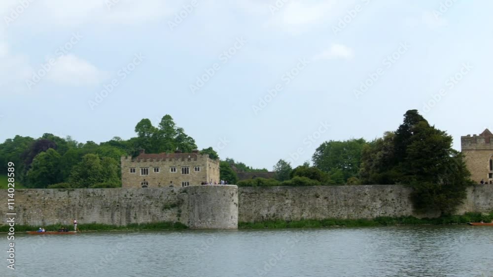 Panning revealing view of a moated medieval castle