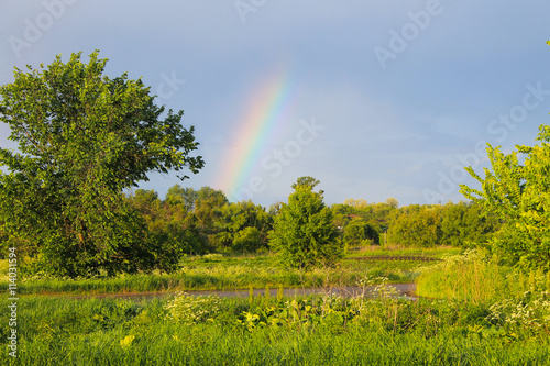 Rural landscape with rainbow