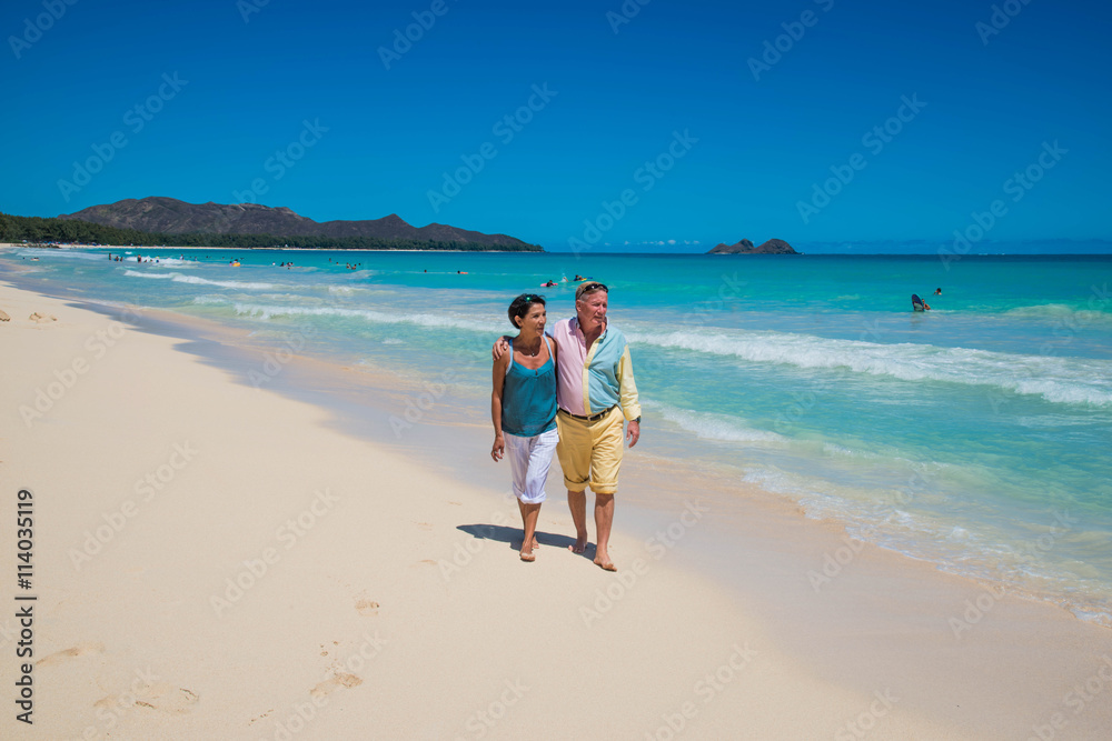 Retirement for older American couple on a tropical beach on Oahu, Hawaii, USA