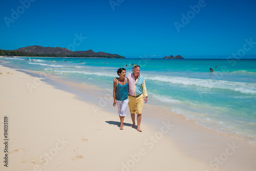 Retirement for older American couple on a tropical beach on Oahu, Hawaii, USA