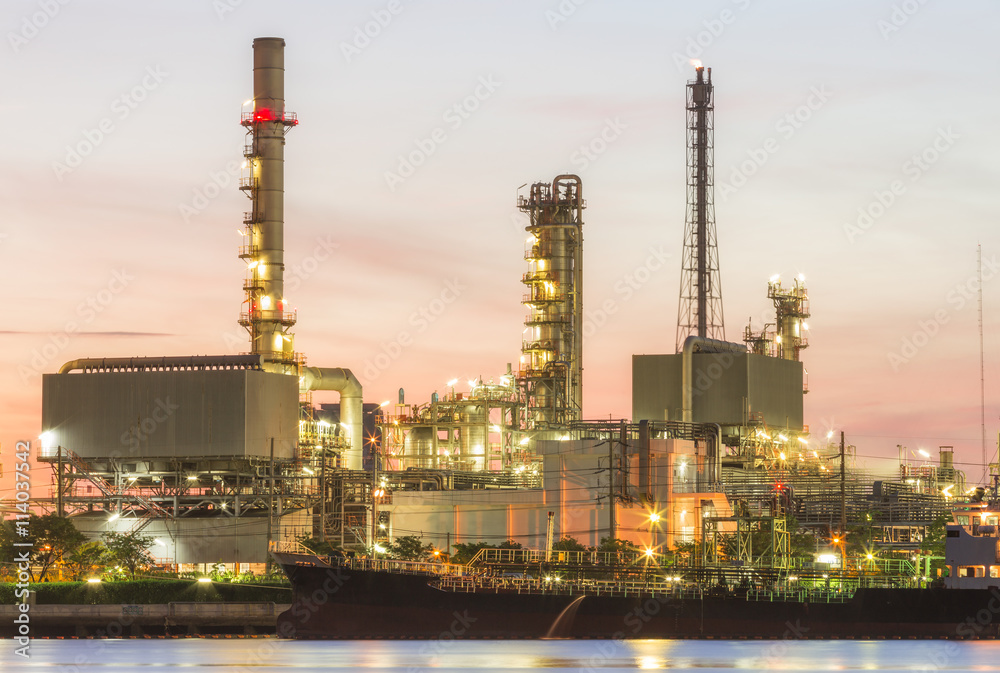 Oil refinery plant at dusk.